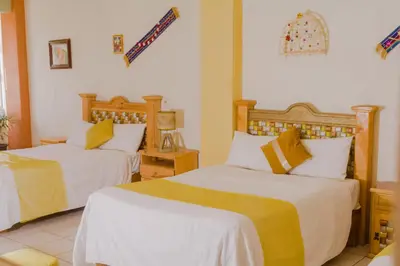 Cama o camas de una habitación en Hotel Carnaval