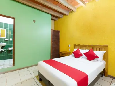 Cama o camas de una habitación en Hotel Posada San Rafael