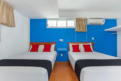 Cama o camas de una habitación en Capital O Hotel El Mejicano, Acapulco