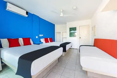 Cama o camas de una habitación en Capital O Hotel El Mejicano, Acapulco