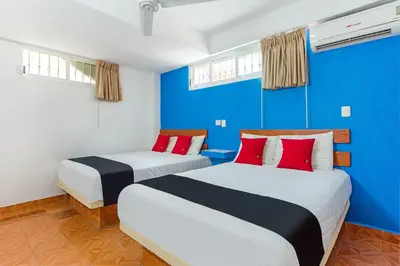 Cama o camas de una habitación en Capital O Hotel El Mejicano, Acapulco