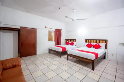 Cama o camas de una habitación en OYO Hotel Betsua Vista Hermosa, Huatulco