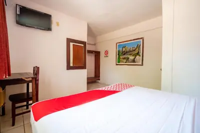 Cama o camas de una habitación en OYO Hotel Betsua Vista Hermosa, Huatulco