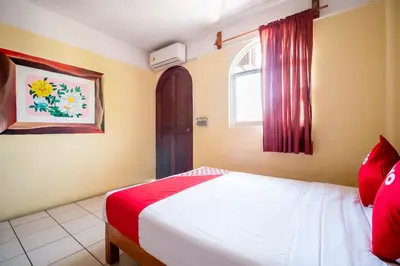 Cama o camas de una habitación en OYO Hotel Betsua Vista Hermosa, Huatulco