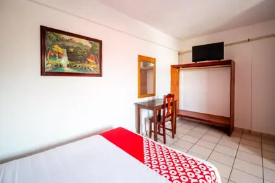 Cama o camas de una habitación en OYO Hotel Betsua Vista Hermosa, Huatulco