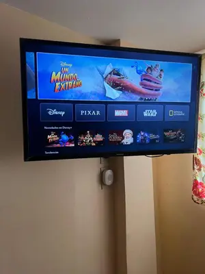 Una televisión o centro de entretenimiento en Hotel magallanes con cocineta 100 Metros de playa