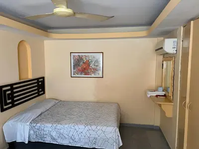Cama o camas de una habitación en Hotel magallanes con cocineta 100 Metros de playa