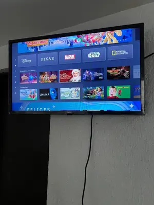 Una televisión o centro de entretenimiento en Hotel magallanes con cocineta 100 Metros de playa