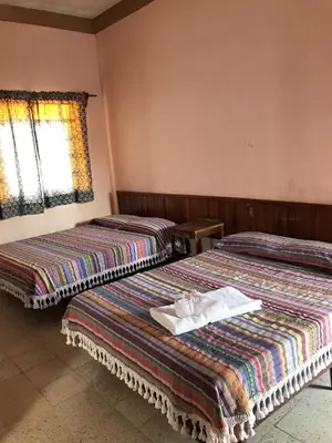 Cama o camas de una habitación en Hotel Izala