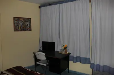 Una televisión o centro de entretenimiento en Posada de Vick