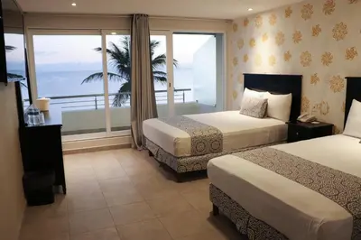 Cama o camas de una habitación en Hotel Costa Verde