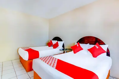 Cama o camas de una habitación en OYO Hotel Margarita