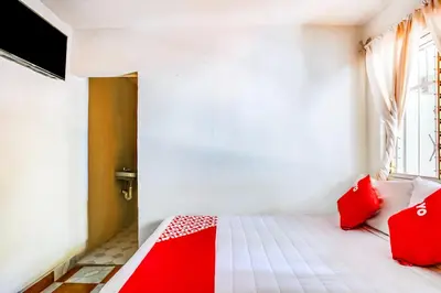 Cama o camas de una habitación en OYO Hotel Margarita