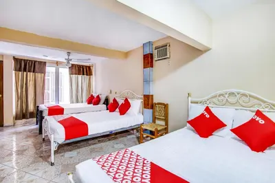Cama o camas de una habitación en OYO Hotel Margarita