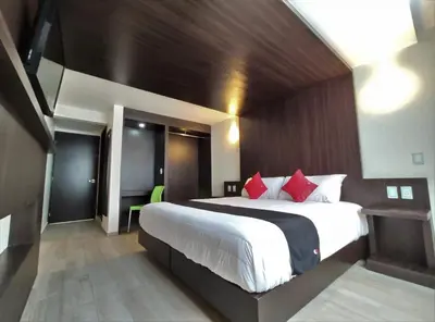 Cama o camas de una habitación en Hotel La Estancia Zacatlan