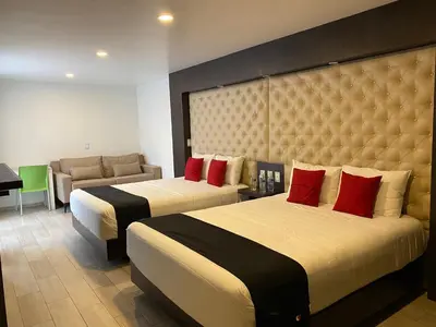 Cama o camas de una habitación en Hotel La Estancia Zacatlan