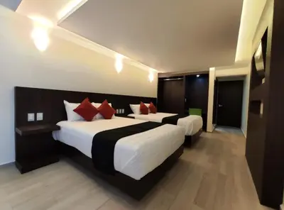 Cama o camas de una habitación en Hotel La Estancia Zacatlan