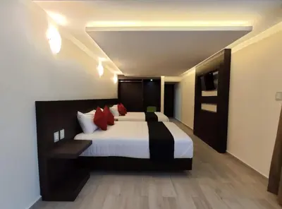 Cama o camas de una habitación en Hotel La Estancia Zacatlan