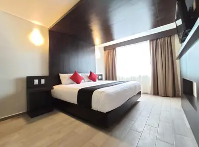 Cama o camas de una habitación en Hotel La Estancia Zacatlan