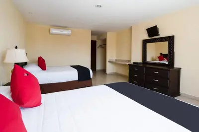 Cama o camas de una habitación en Capital O Hotel Los Caracoles, Acapulco