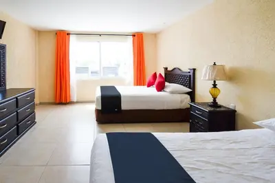 Cama o camas de una habitación en Capital O Hotel Los Caracoles, Acapulco