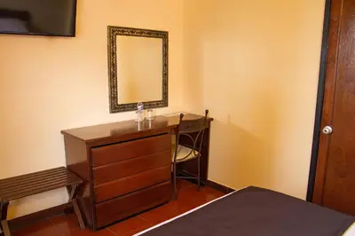 Cama o camas de una habitación en Hotel Posada Santa Bertha