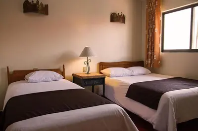 Cama o camas de una habitación en Hotel Posada Santa Bertha