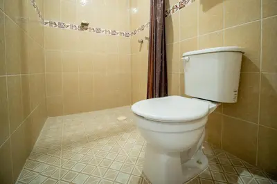 Un baño de OYO Hotel Posada San Vicente, Huatulco