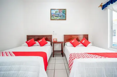 Cama o camas de una habitación en OYO Hotel Posada San Vicente, Huatulco