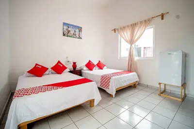 Cama o camas de una habitación en OYO Hotel Posada San Vicente, Huatulco