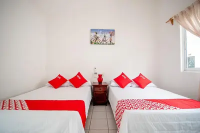 Cama o camas de una habitación en OYO Hotel Posada San Vicente, Huatulco