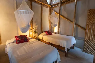Cama o camas de una habitación en Los Amigos Ecoturismo y Reserva Natural