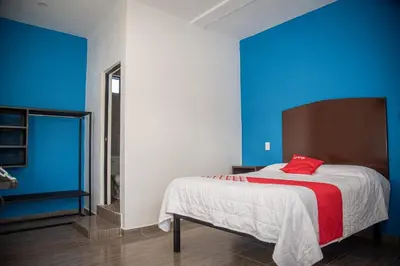 Cama o camas de una habitación en OYO Casa Vieja,Ciudad Serdán,Museo La Magnolia