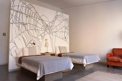 Cama o camas de una habitación en Hotel Cosijo - San Jeronimo Tlacochahuaya