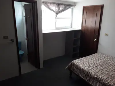 Cama o camas de una habitación en Posada Loreto Xalapa