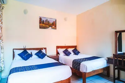 Cama o camas de una habitación en Capital O Hotel Aurora, Tuxtla Gutiérrez