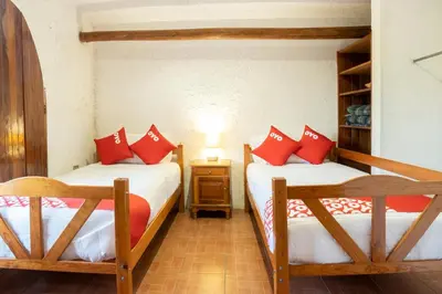 Cama o camas de una habitación en OYO Posada Astrud,Cuetzalan