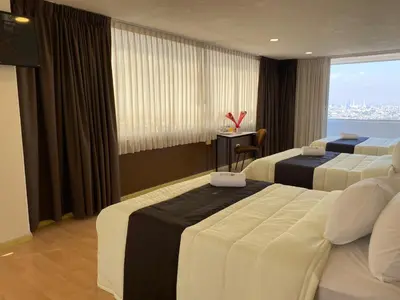 Cama o camas de una habitación en Puebla Inn Express