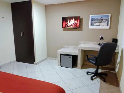 Una televisión o centro de entretenimiento en EXECUTIROOMS VERACRUZ