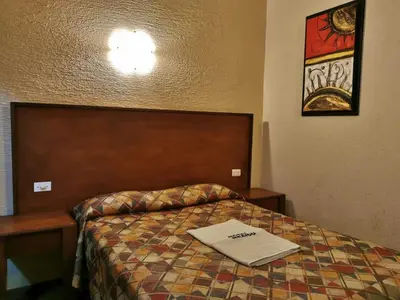 Cama o camas de una habitación en Hotel Mexico