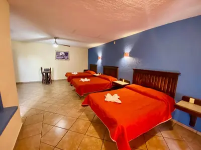 Cama o camas de una habitación en Hotel Cabañas Santa Cruz