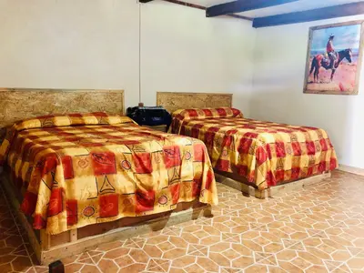 Cama o camas de una habitación en Cabañas el Pajar