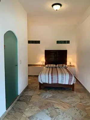 Cama o camas de una habitación en La Buena Suerte