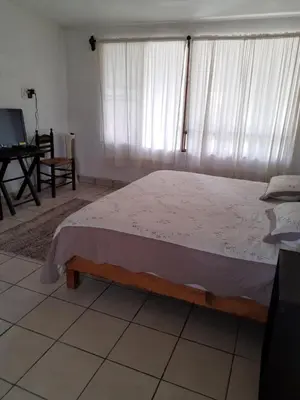 Cama o camas de una habitación en Posada Bugambilias