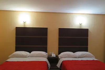 Cama o camas de una habitación en Hotel BONADAY Inn
