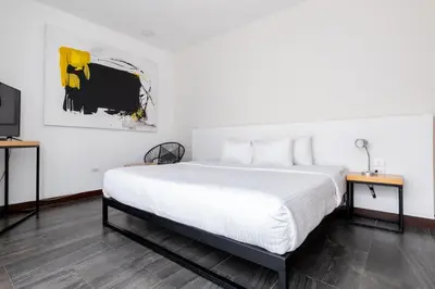 Cama o camas de una habitación en Urban Puebla by Grupo Amber