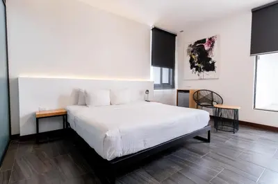 Cama o camas de una habitación en Urban Puebla by Grupo Amber