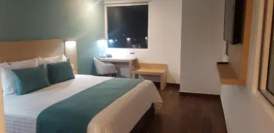 Cama o camas de una habitación en Hotel Plaza Sol Veracruz
