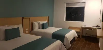 Cama o camas de una habitación en Hotel Plaza Sol Veracruz