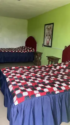 Cama o camas de una habitación en Hotel Villa Aventura
